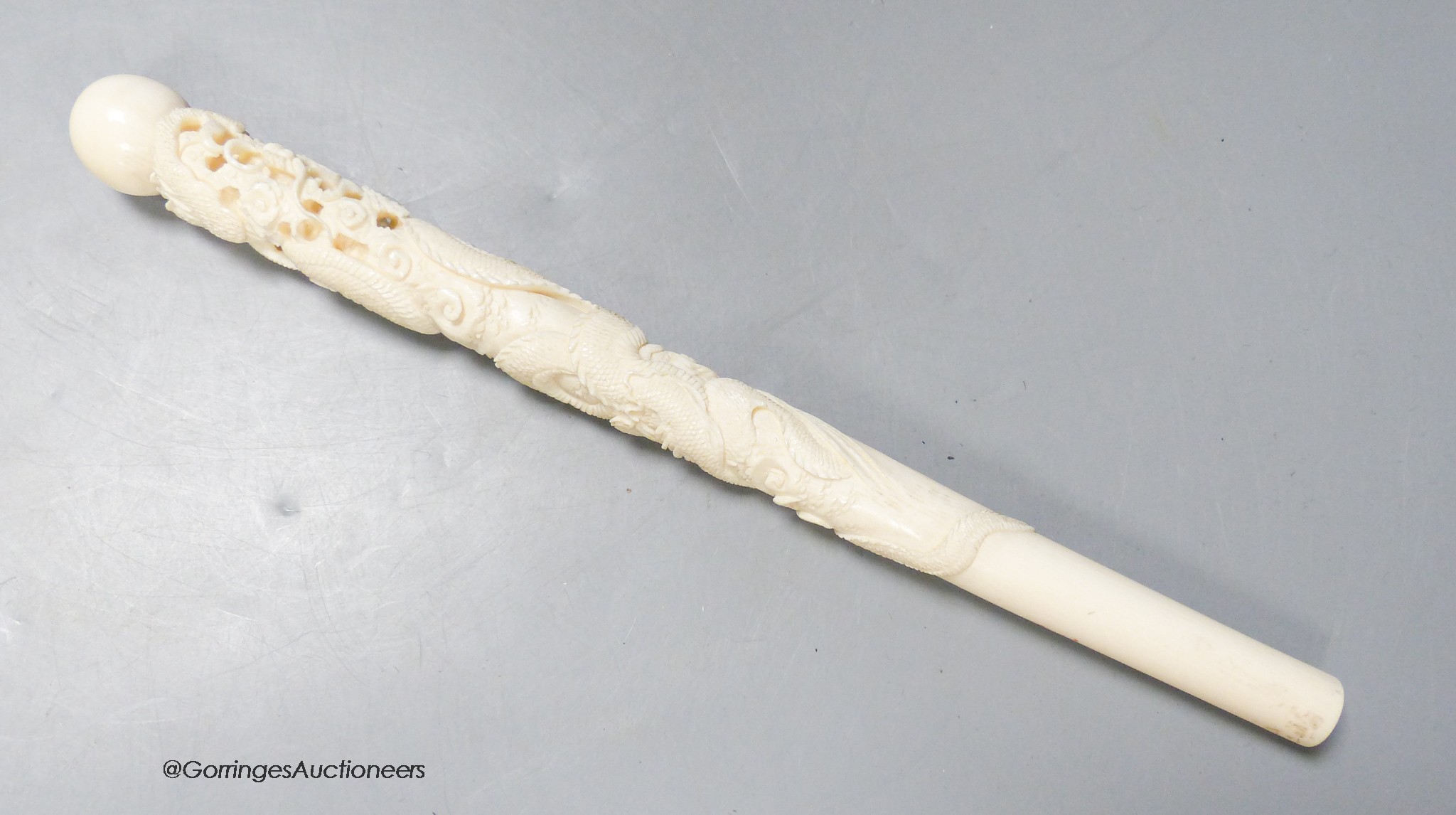 A Japanese ivory 'dragon' parasol handle, early 20th century, signed